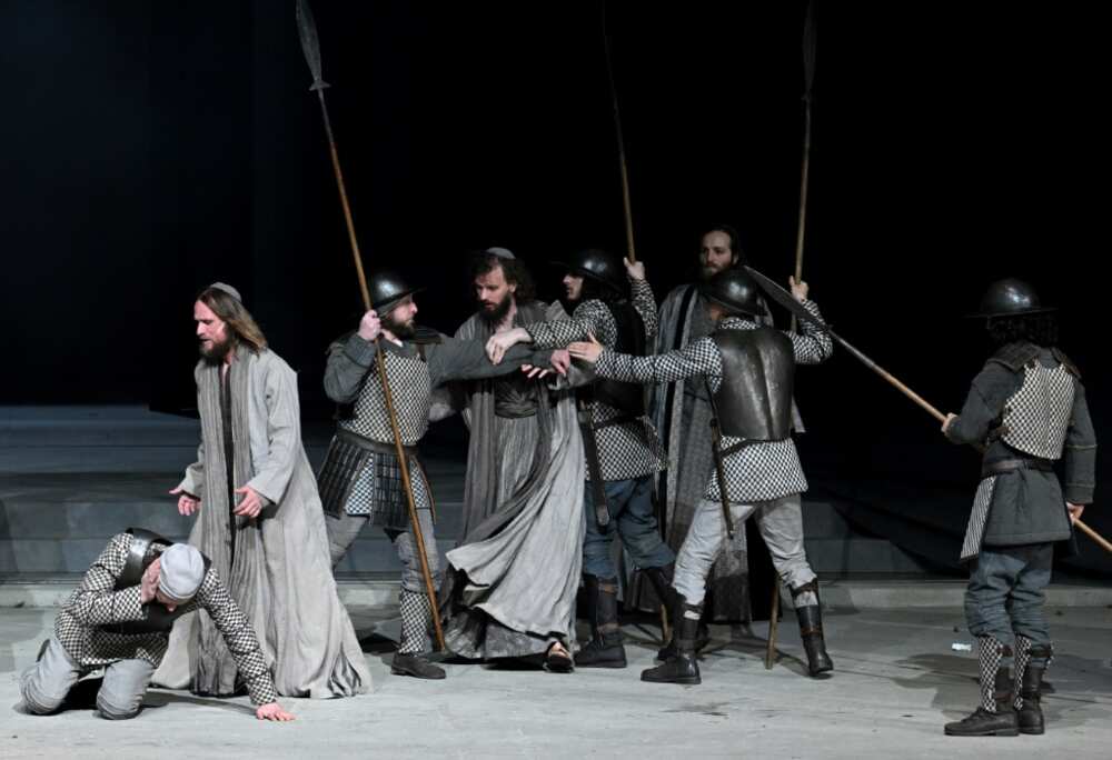 The play's themes of violence, poverty and sickness are reflected in today's world through the war in Ukraine and Covid, says Frederik Mayet (2ndL) who plays Jesus The play's themes of violence, poverty and sickness are reflected in today's world through the war in Ukraine and Covid, says Frederik Mayet (2ndL) who plays Jesus
