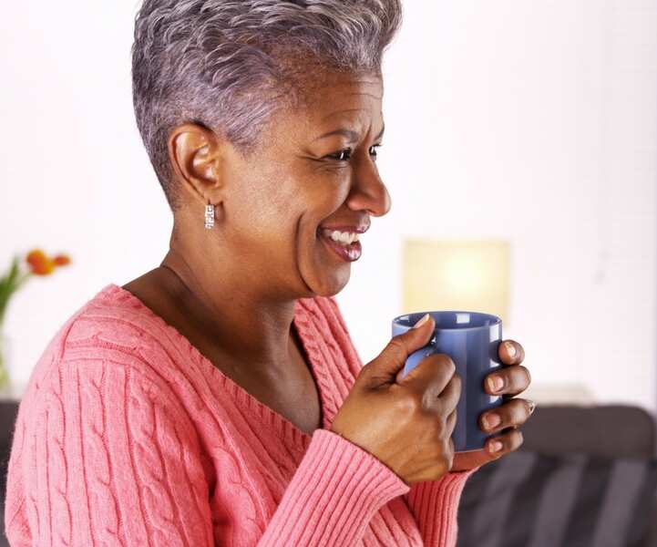 A woman drinking guava leaf tea