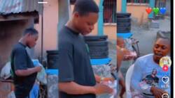 Reactions as young man surprises father on his birthday, sprays him N100 notes