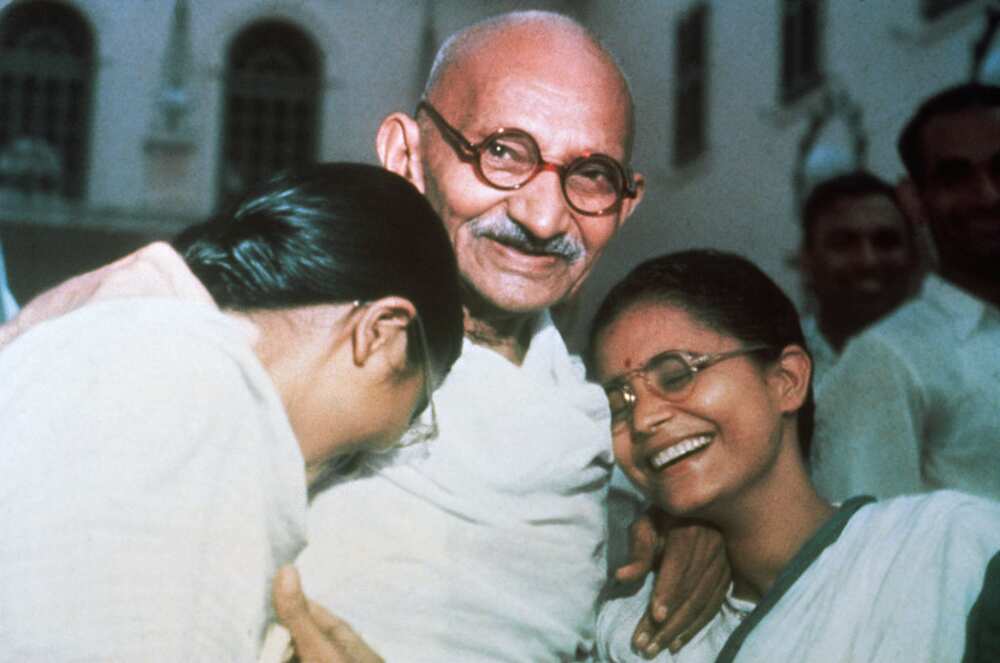 Mahatma Gandhi enjoys a laugh with his two granddaughters