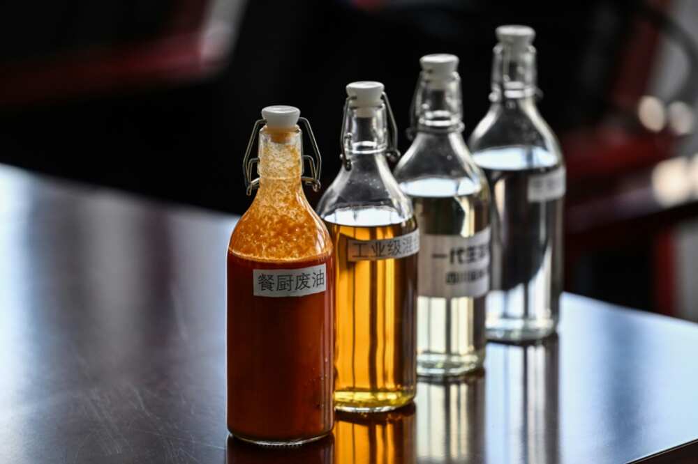 Samples of used oil in various stages of the refining process are displayed at Jinshang's plant Samples of used oil in various stages of the refining process are displayed at Jinshang's plant