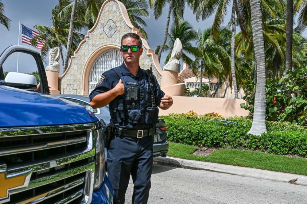 Local law enforcement officers in front of the Mar-a-Lago home of former president Donald Trump in Palm Beach, Florida Local law enforcement officers in front of the Mar-a-Lago home of former president Donald Trump in Palm Beach, Florida