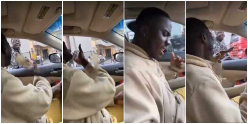 Social media reacts as Nigerian man blows kiss to female beggar while in traffic and gives her cash in video