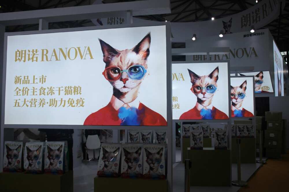 Posters for cat food are seen at Pet Fair Asia in Shanghai Posters for cat food are seen at Pet Fair Asia in Shanghai
