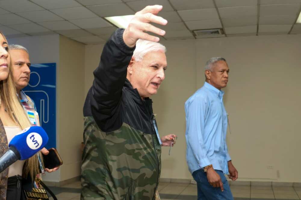 Former Panamanian president Ricardo Martinelli gestures before the arrival of his two sons, Luis Enrique Martinelli and Ricardo Martinelli Jr, in Panama City after they were released from a US prison where they served time for corruption