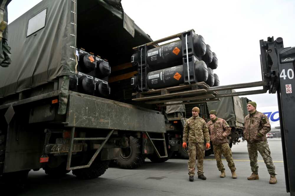 Ukrainian servicemen load a truck with US-supplied Javelin anti-tank missiles on February 11, 2022