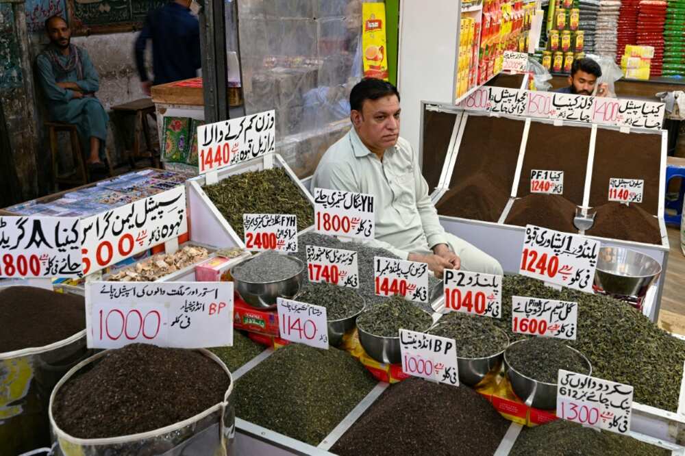 A tea seller waits for customers at his market shop in Rawalpindi. Year-on-year inflation hit 37.97 percent in May, according to latest data