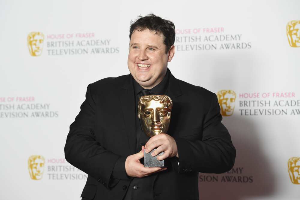 Peter Kay holding the Male Performance in a Comedy Programme award