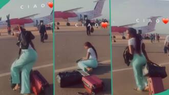 "Sorry sis": Nigerian lady falls on ground while doing video at airport, embarrassing clip trends