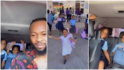 Cute video as singer Flavour’s daughters run to hug him, call him the best papa as he picks them from school