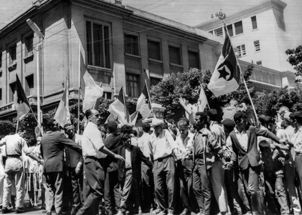 In this file photo taken on July 2, 1962, young Algerians celebrate in Algiers a day after the self-determination referendum