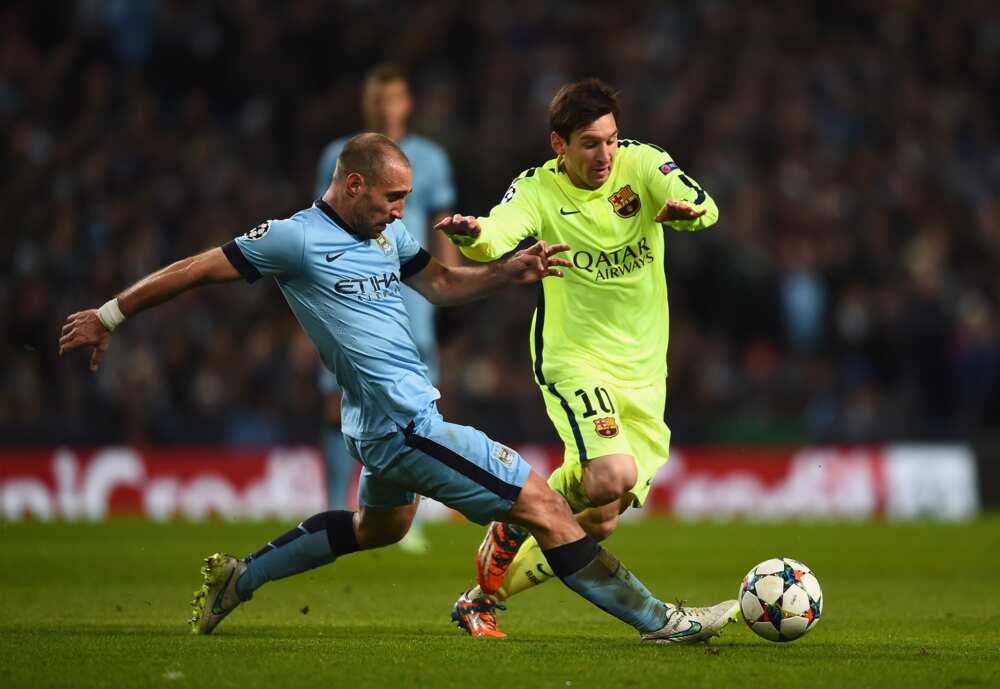 Pablo Zabaleta and Lionel Messi in action.