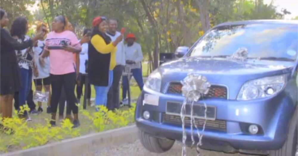 Jeinabor Sor from Zambia, husband gifts wife a car, wife rolls on ground, wife weeps