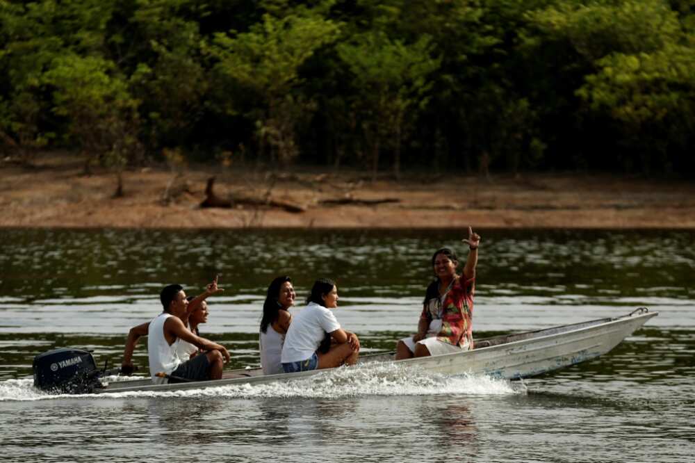 A boat ferries indigenous Kambeba people to vote in the Brazilian Amazon