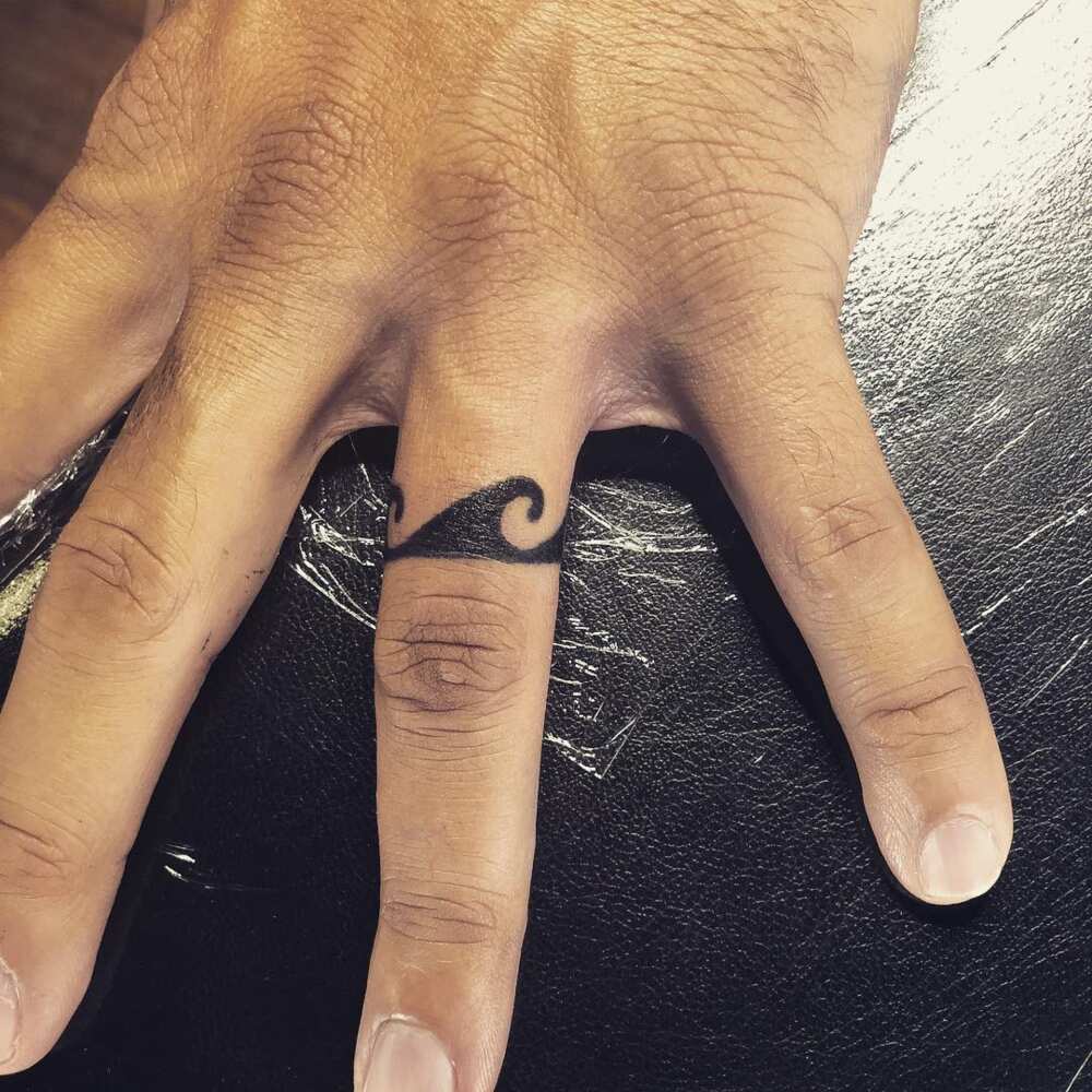 ring finger tattoo