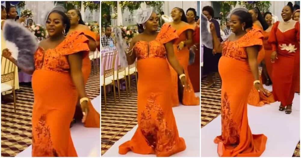 Pregnant bride grabs the spotlight at her wedding.