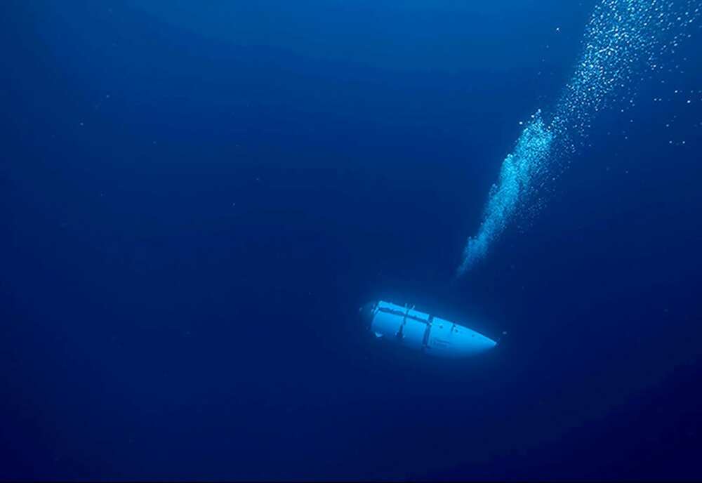 OceanGate, which operated the Titan sub (pictured here during an undated descent) before it imploded last month, said it is suspending all expeditions