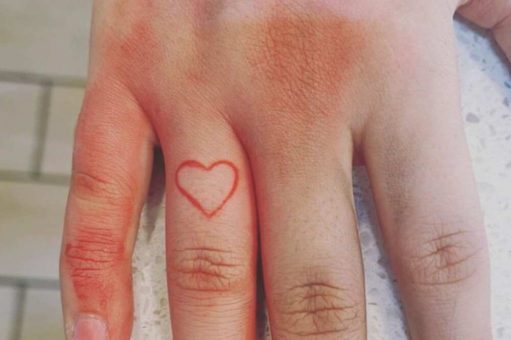 heart finger tattoo