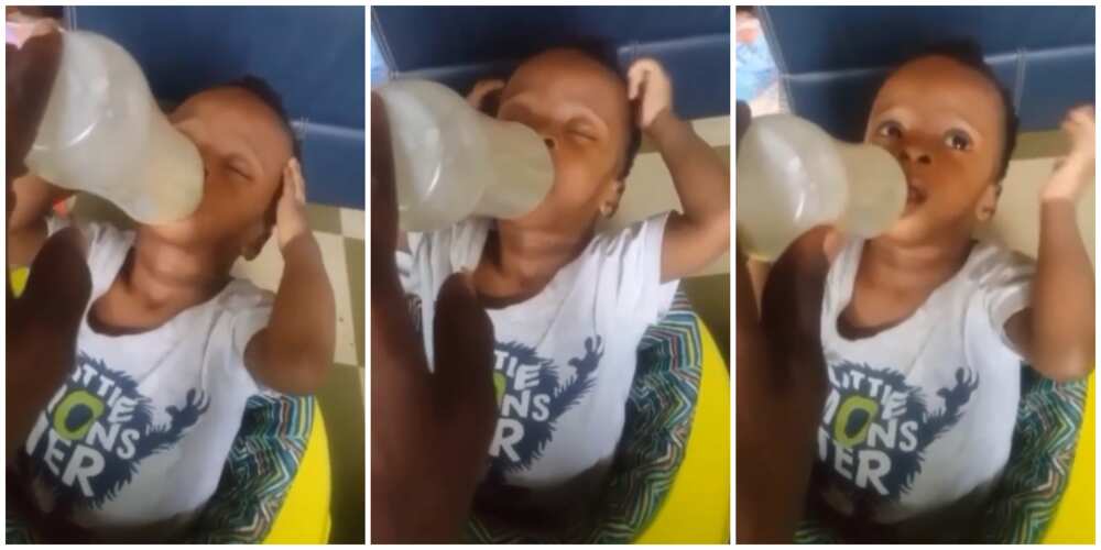 Viral video of a little boy massaging his head as he consumes bottle of milk