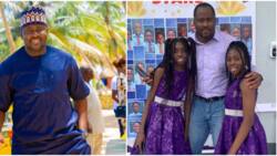 Desmond Elliott strikes cute pose with his daughter and her best friend as they graduate junior school