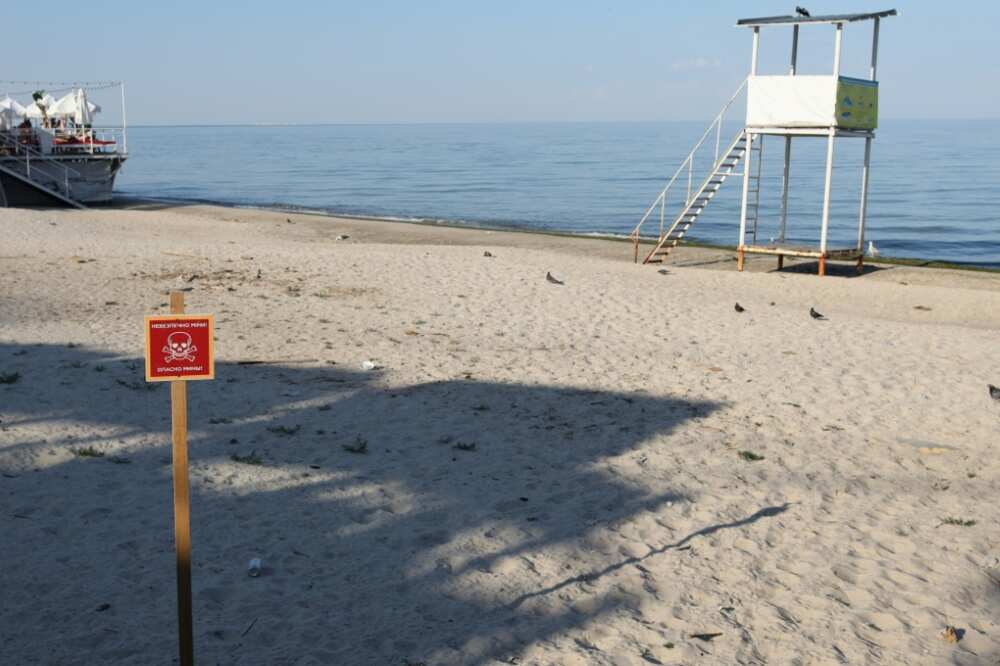 Signs warn people not to go swimming in the waters off Odessa