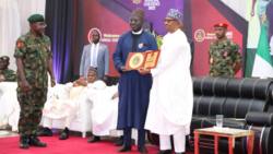 Reaction as President Buhari presents Buratai special recognition gong