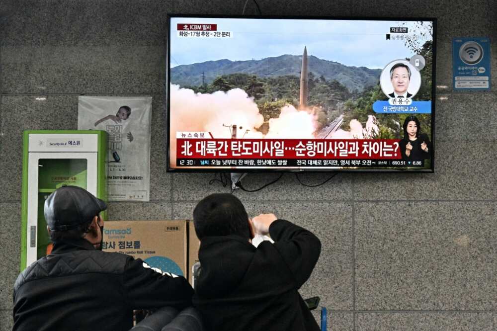 Visitors watch file footage of a North Korean missile test at the ferry terminal of South Korea's Ulleungdo island earlier this month