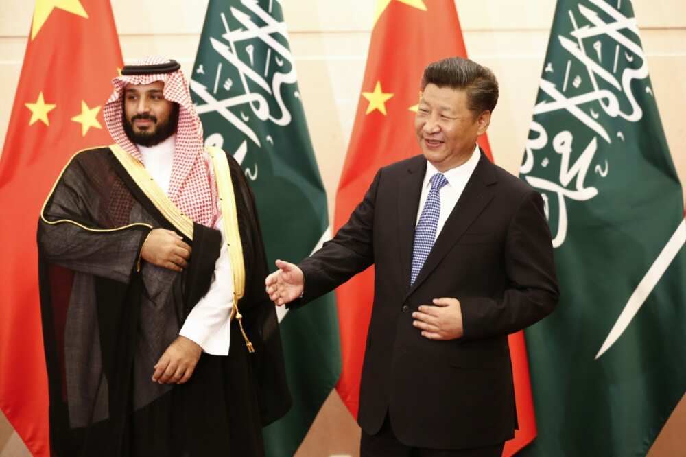 Chinese President Xi Jinping arrives in Saudi Arabia on Wednesday for three days of meetings: in this 2016 photograph he greets Crown Prince Mohammed bin Salman in Beijing