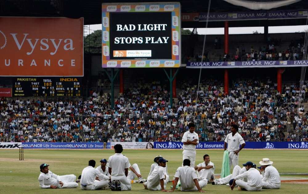 Indian cricketers wait on the ground after bad light stopped play in Bangalore in December 2007 -- the last time the two nations met in a Test match