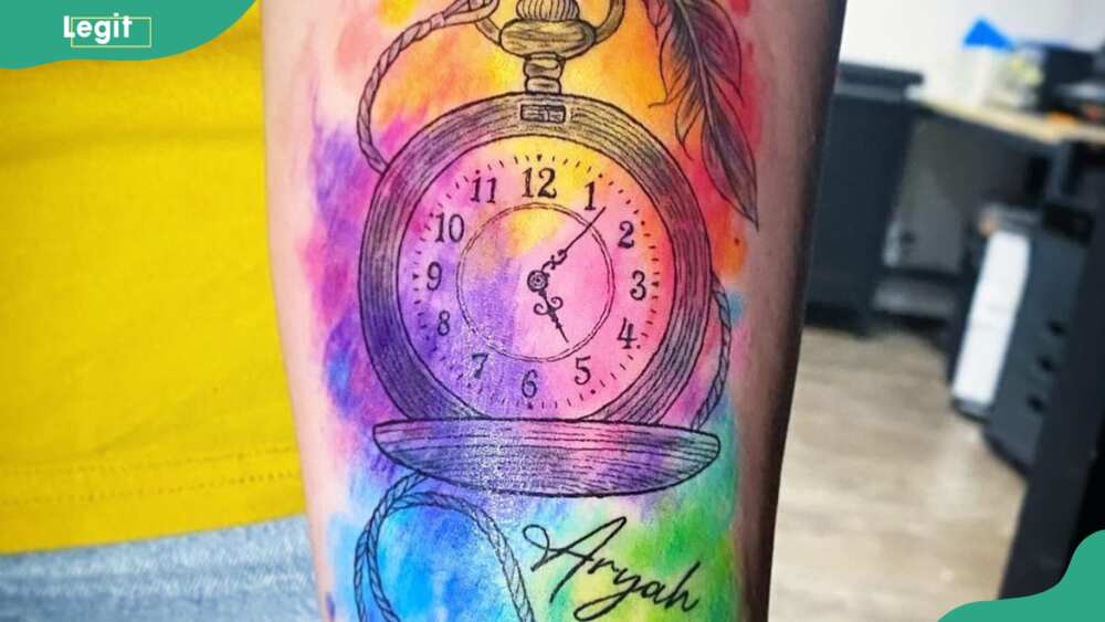 Watercolour clock tattoo