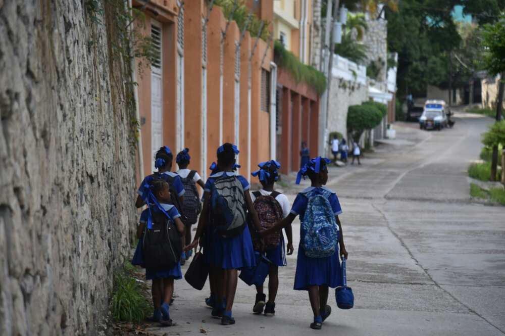 Children return home from school in the Haitian capital of Port-au-Prince in November 2018