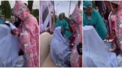 Lady 'marries her man,' unveils his covered face after spraying him money at wedding, video goes viral