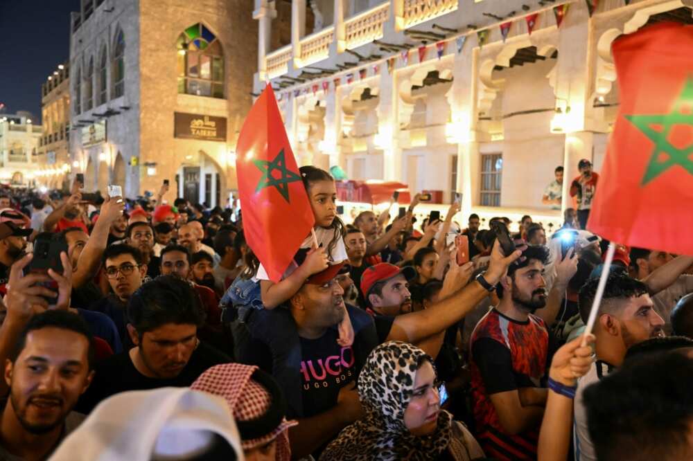 Morocco fans celebrate their last-16 win against Spain in the World Cup in Doha