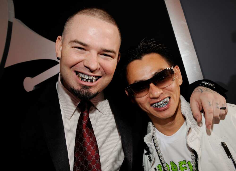Rapper Paul Wall (L) and Johnny Dang pose for photo (R).