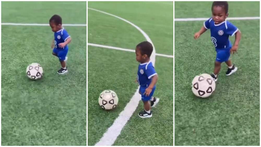 Young boy runs with ball