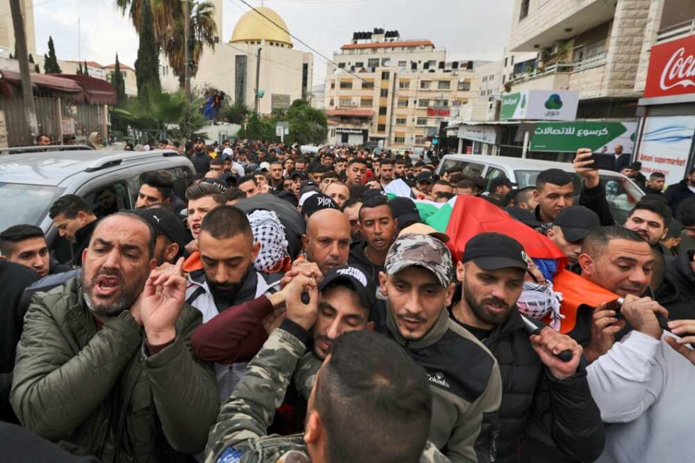 Palestinian mourners attend the funeral of Mohammad Abu Kushuk, killed during clashes with Israeli forces