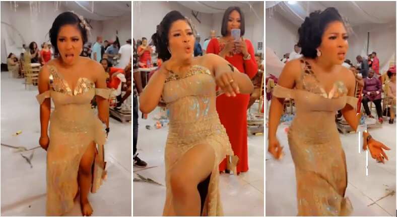 Nigerian bride in beautiful gold reception gown dances aggressively in stunning video