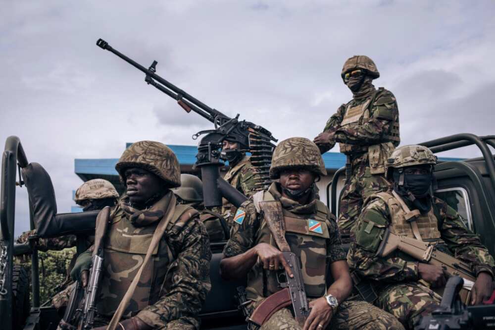 Kenyan and Congolese troops standing guard last week at Goma airport in eastern DR Congo