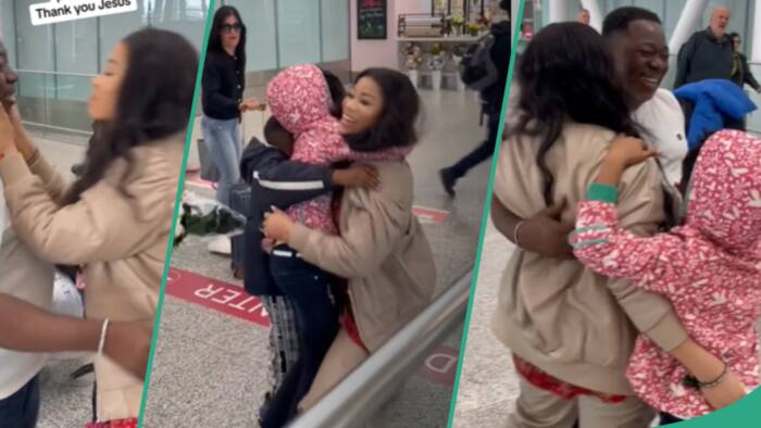 Wife in Canada kneels in joy as husband, 3 children join her abroad, they hug at airport
