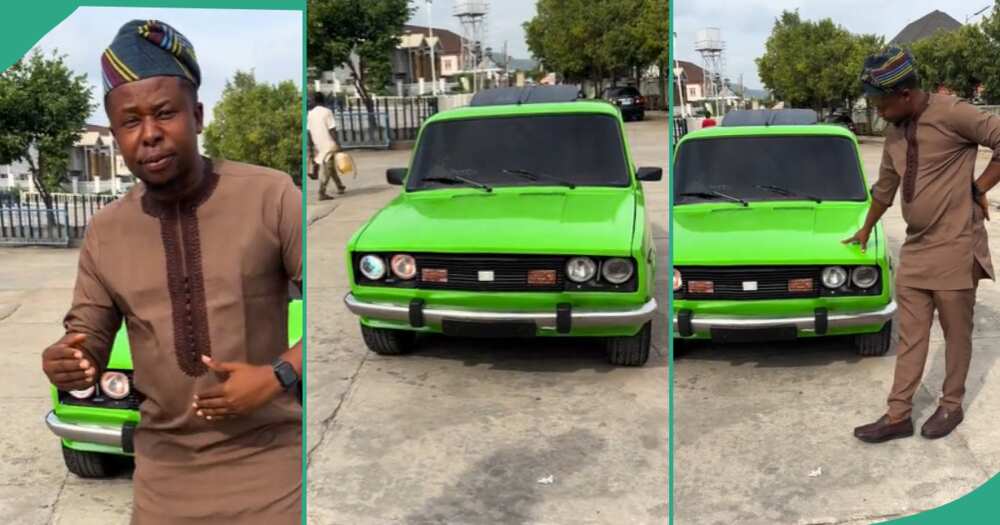 Man shows off an old car.