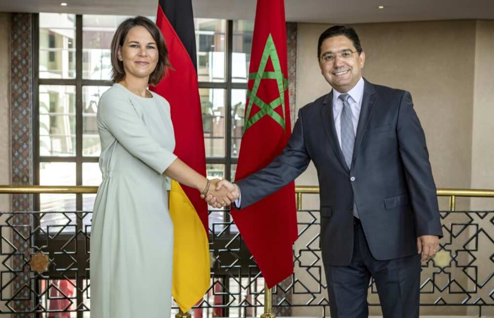 German Foreign Minister Annalena Baerbock shakes hands with Moroccan counterpart Nasser Bourita on a visit to Rabat