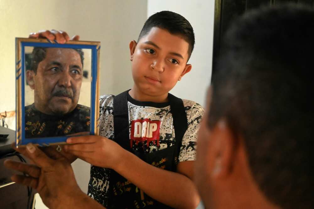 Eduardo Espinal, 12, works as a barber, one of tens of thousands of Honduran children at work rather than being at school