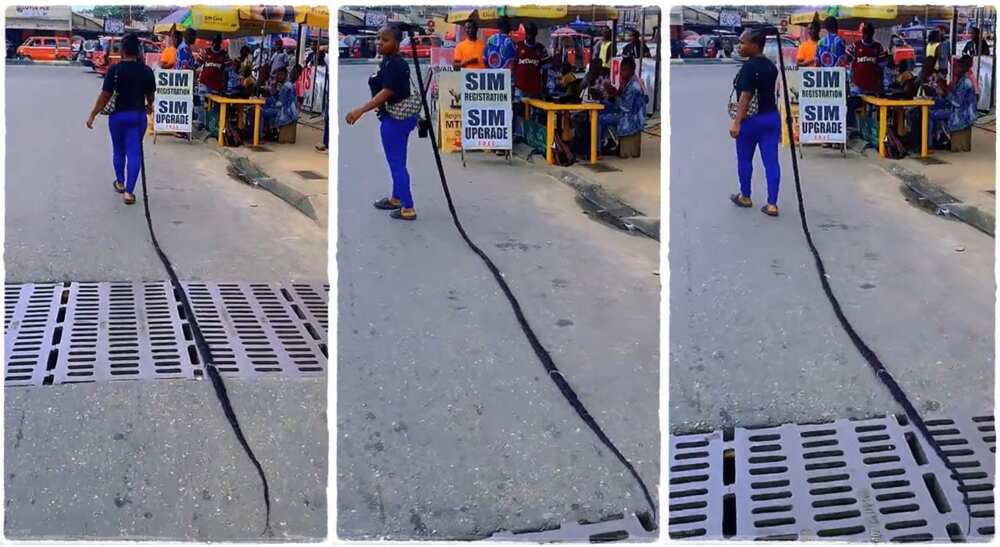 Lady parades the streets with long braids.