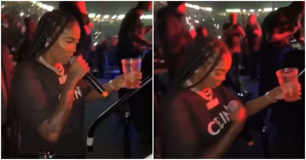 Stop insulting God: Reactions as Tiwa Savage does the cross sign with alcohol in one hand before performance