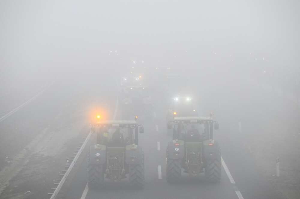Tractors block off the A2 highway near the Spanish city of Lerida as farmers demand a better deal for their produce