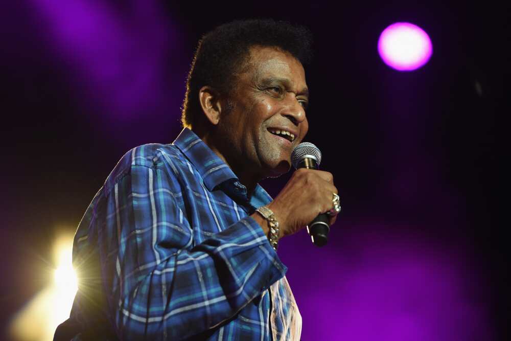 The late Charley Pride performing on stage