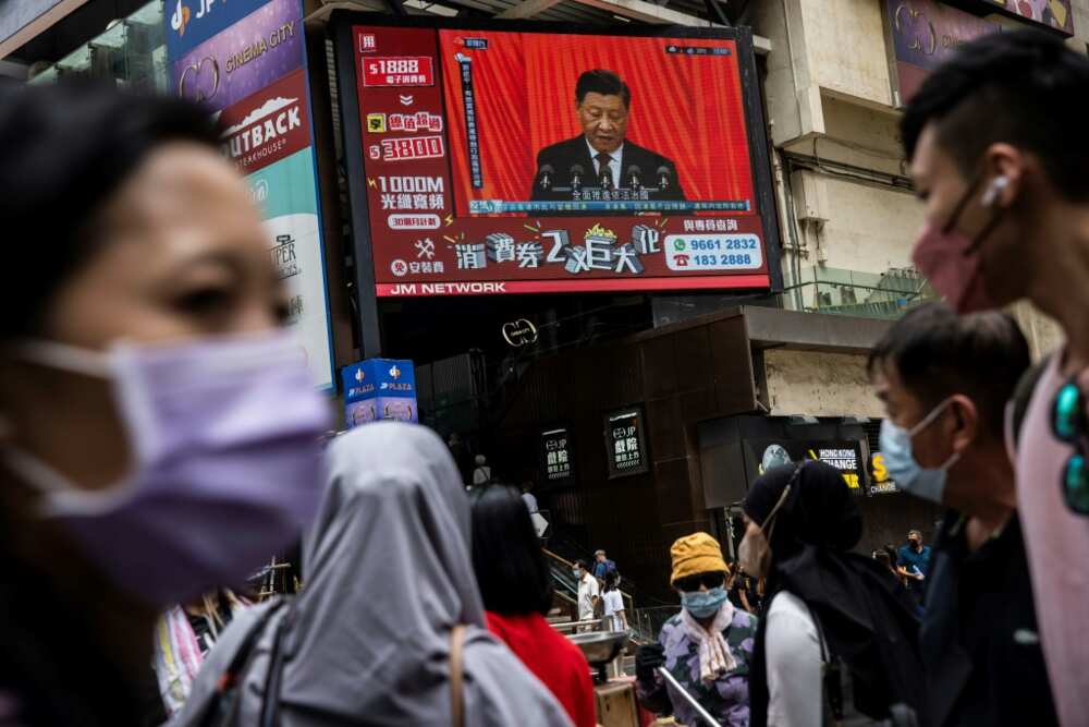 President Xi's speech at the Communist Party congress seen from the street in Hong Kong