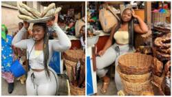 Photos of a beautiful and well endowed fish seller go viral on the internet