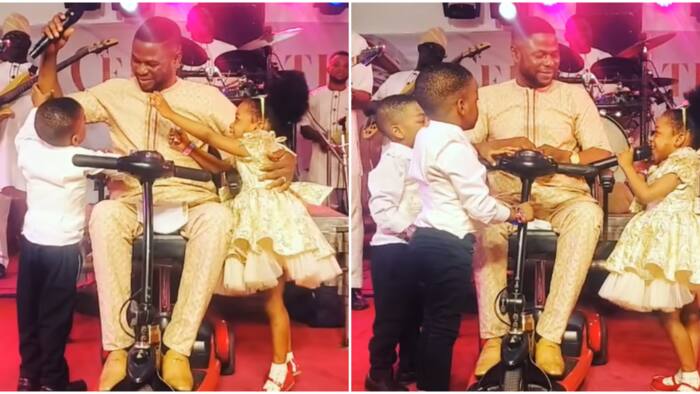 Beautiful video of moment Yinka Ayefele's triplets storm the stage, fight for microphone as he performs