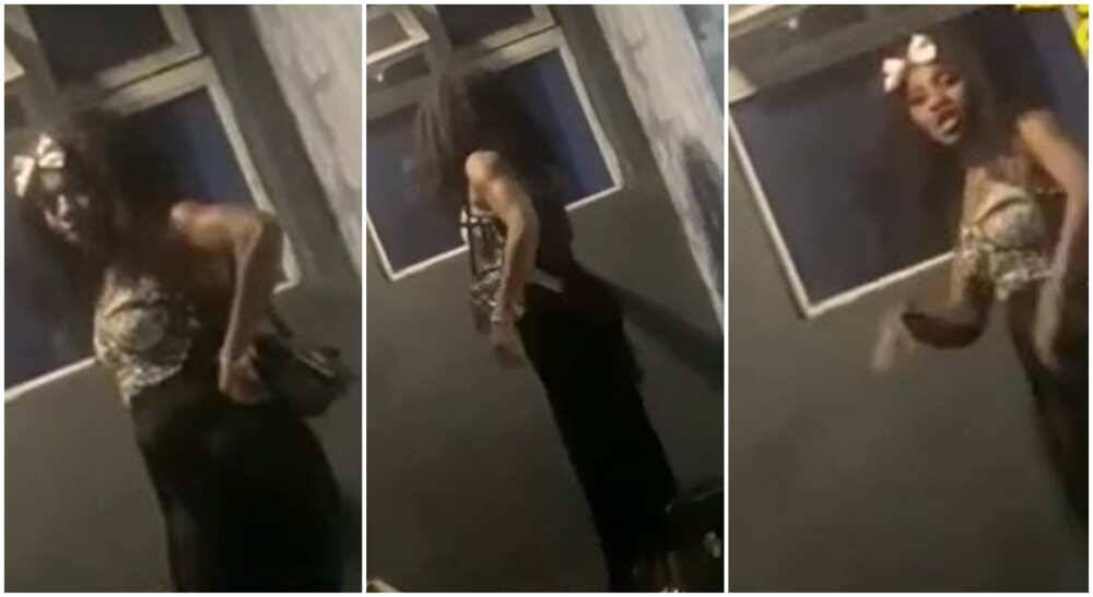 Photos of a Nigerian woman standing at the window of a Lagos hotel where her boyfriend is lodging with another woman.